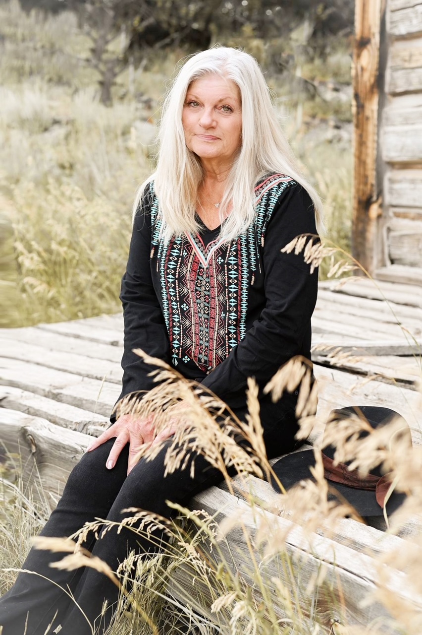 Author Marje Porter, Sitting on Old Wooden Porch in Rural Colorado